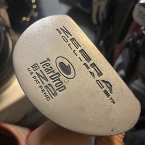 Zebra roll face golf putter in right hand  Steel shaft 35