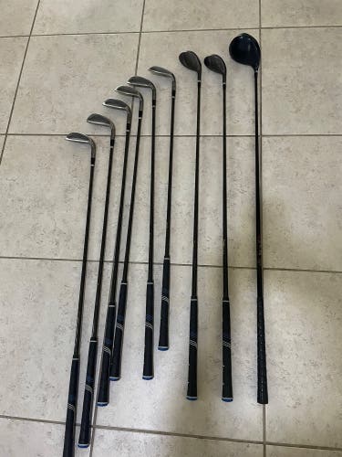 Mens golf set 9 pc Gray cat irons and woods in right hand