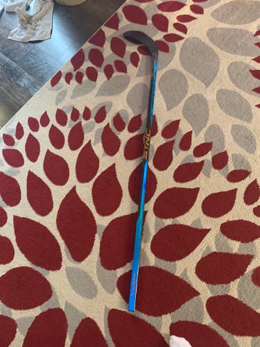 Senior Right Handed P92 Nexus Sync Hockey Stick Crack in the heel and chip in the toe.
