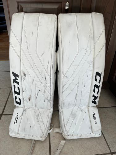 Used one season - CCM Axis1.5 size 26+1 leg pads