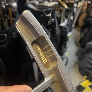Wilson TPA 5 golf putter in right hand