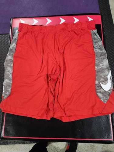 Men's Nike BSBL Shorts Red with camo print on sides. SZ XXL