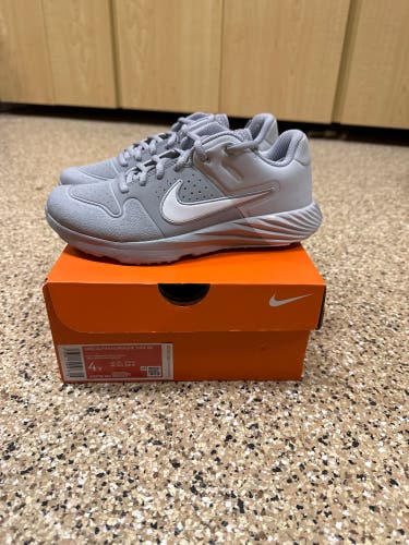 Brand new in box!! Nike Youth Alpha Huarache Turfs, size 4Y, wolf grey/white/pure platinum