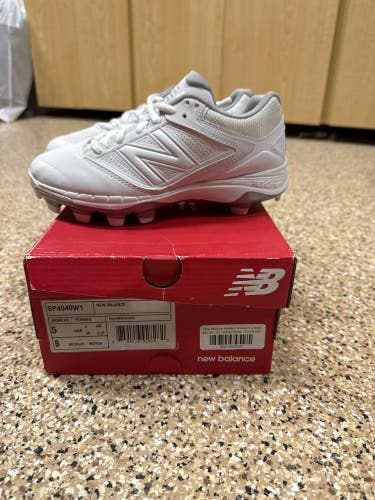 Brand new, in box!! Women’s New Balance SP4040 Molded Cleat, White, Size 5