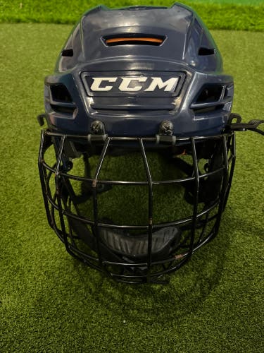 Very Good condition Used Large CCM Tacks 710 Helmet With cage In Navy