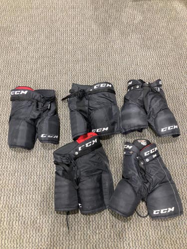 Youth Used Medium and One Small  CCM Hockey Pants Bundle
