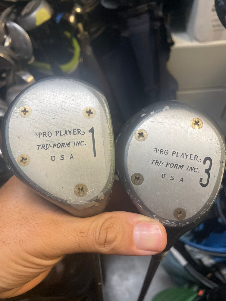 Pro player vintage driver and 3 wood in right hand