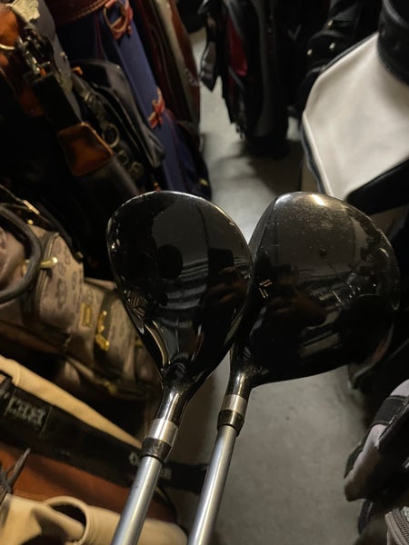Zero tolerance golf driver and 7 wood in right Hand