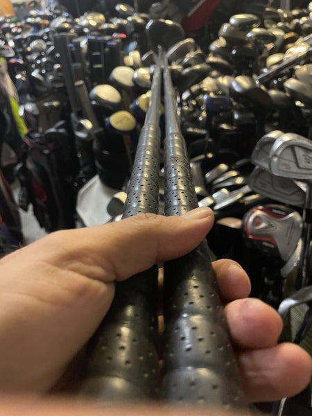 Zero tolerance golf driver and 7 wood in right Hand