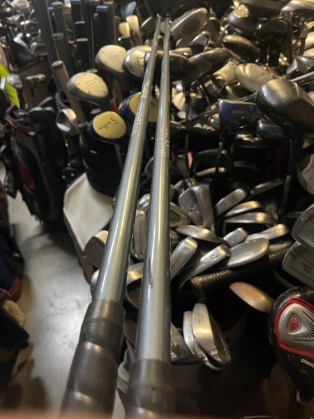 Zero tolerance golf driver and 7 wood in right Hand