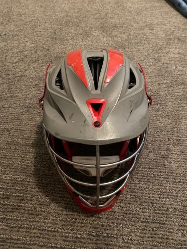 gray and red cascade lacrosse helmet