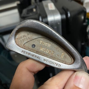 Tour model II iron 1 in right hand