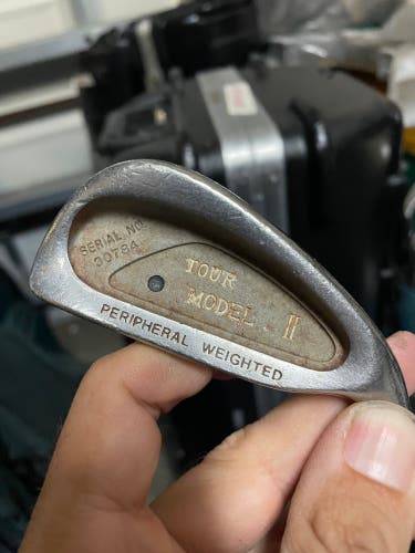 Tour model II iron 1 in right hand