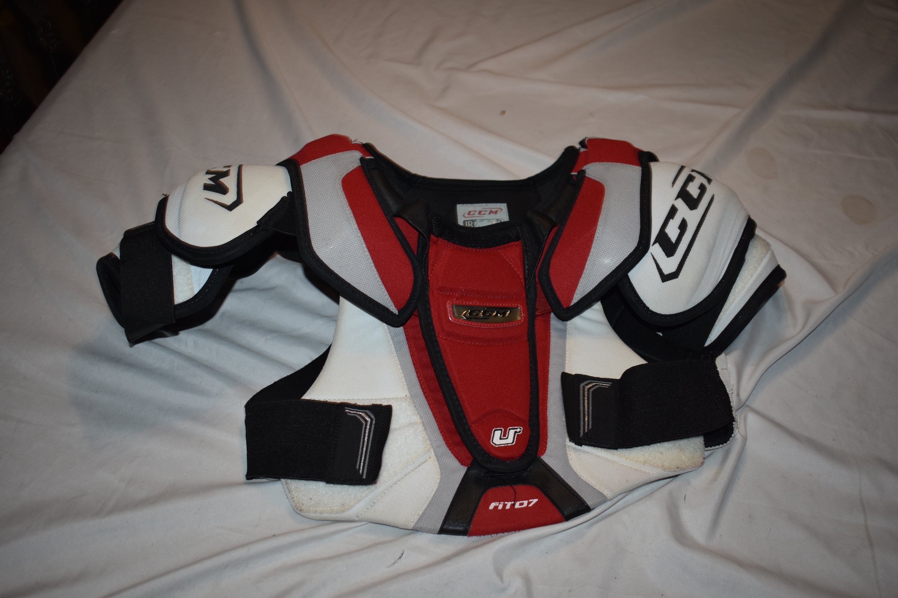 CCM U+ Fit 07 Hockey Shoulder Pads, Red/White, Junior Large