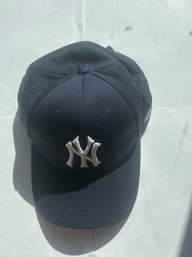 Navy blue Yankees hat, Velcro latched in the back