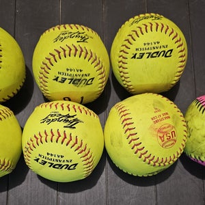 Used Softball 6 Pack 11" Plus bonus ball.