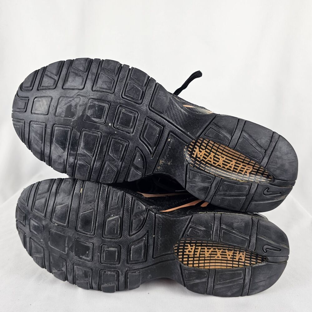 black nike trainers with rose gold tick