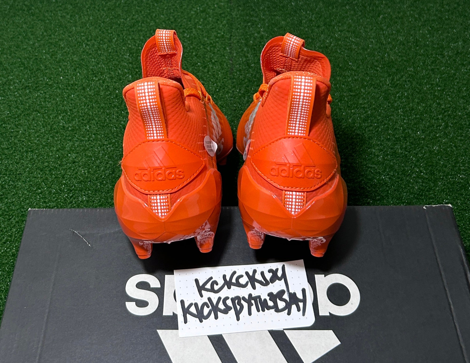 mens orange football cleats