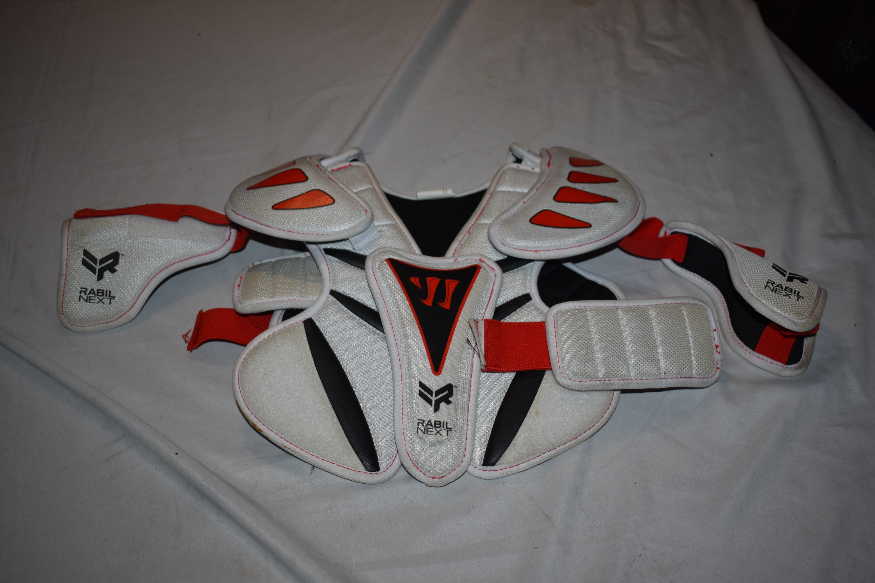 Warrior Rabil Next Lacrosse Shoulder Pads, White/Red/Black, Youth Medium
