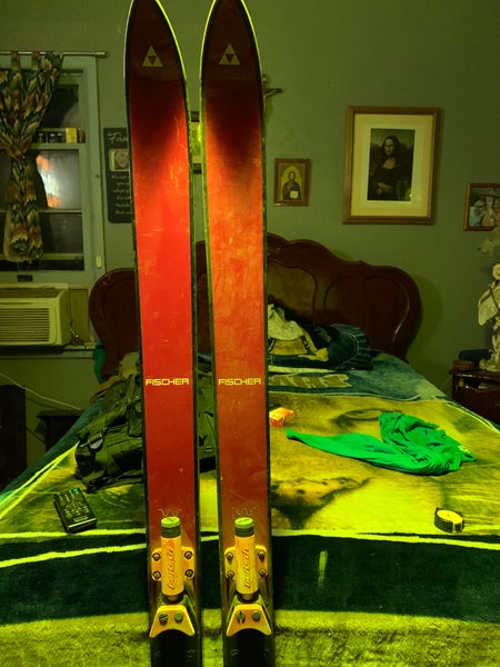 Solved An 79.5 kg skier is gliding on her waxed wood skis