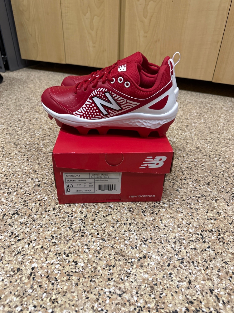 Brand New, in box!!! Women’s New Balance Fastpitch Fresh Foam Velo V2 molded cleats, size 6.5, red