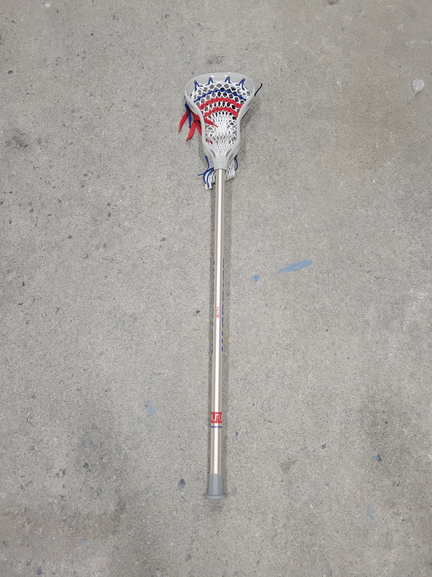 23' New Warrior Burn Next Complete Attack Stick Silver/Red, White, and Blue