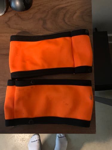Ice Hockey Referee Button On Orange Arm Bands