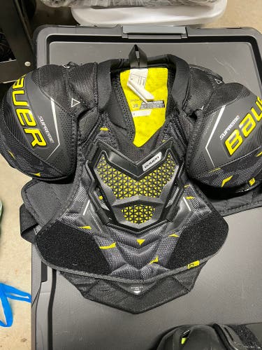 Used Medium Bauer  Shoulder Pads