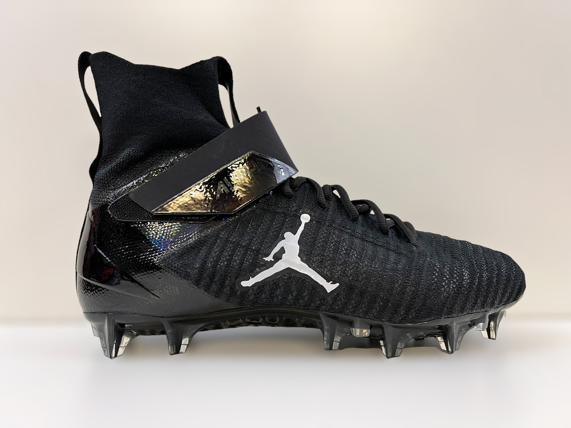 black and gold nike football cleats
