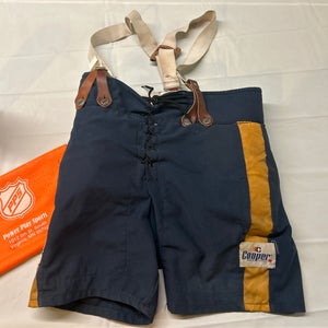 Used Cooper Jr. Large Hockey Pants. Navy/yellow.