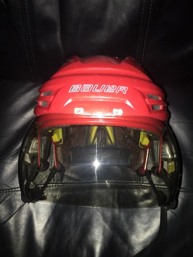 Bauer Re-Akt original red hockey helmet with dark Bauer tinted visor