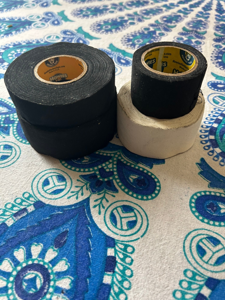 4 Rolls of Used Howies Tape - 3 Black, 1 White