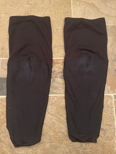 Used CCM pro stock practice hockey socks - large - black