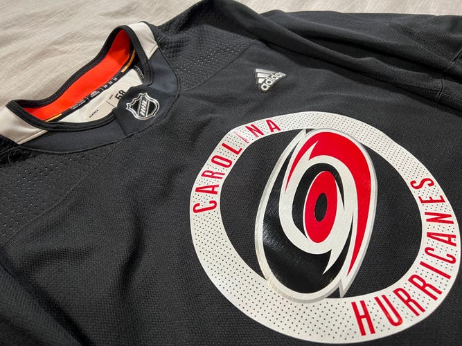 Carolina Hurricanes (MiC) Made in Canada Size 58 Black Adidas Practice Jersey.