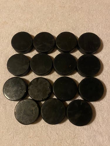 15 Used Black Hockey Pucks