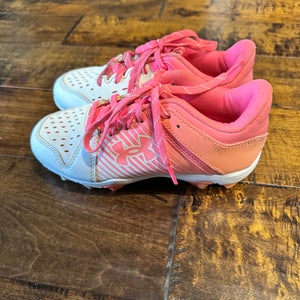 Pink and White Under Armor Kid's Molded Cleats Size 2