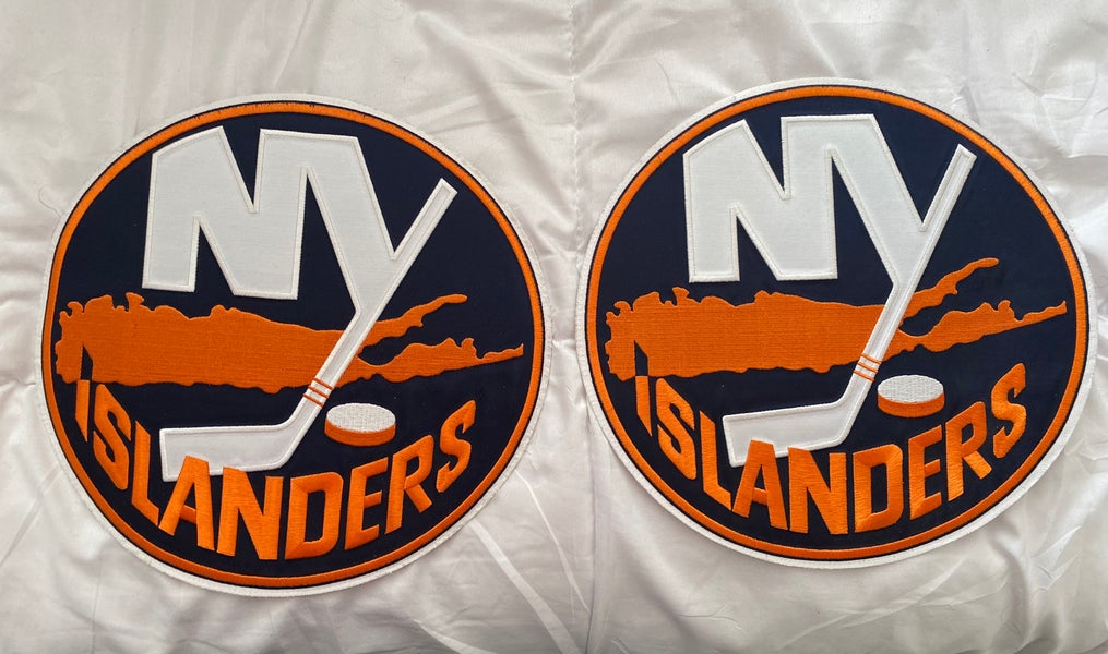Two NHL authentic New York Islanders jersey main crests
