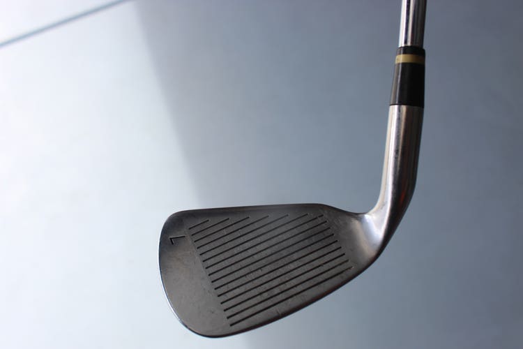 used Men's right handed Cobra CXI 7 iron with a stiff flex steel shaft
