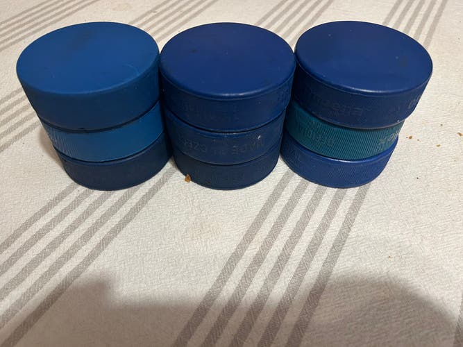 10 Used Blue Ice Hockey Pucks