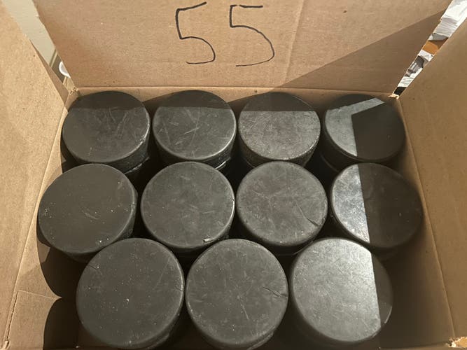 55 Used Ice Hockey Pucks