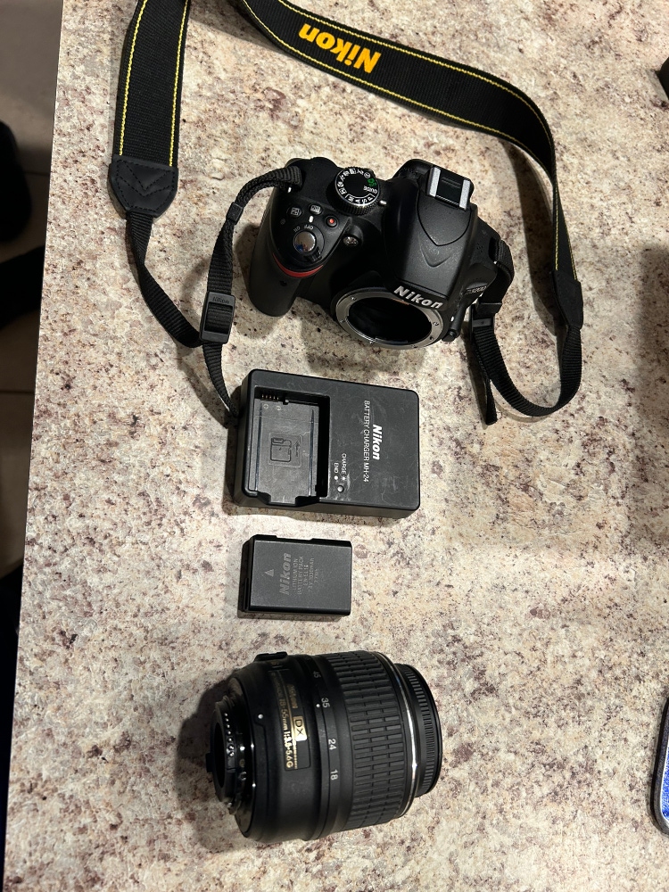 Nikon dx camera with lens battery and battery charger