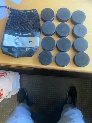 Used Winnwell hockey pucks