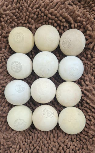 12 Pack Lacrosse Balls (White) -discolored, good bounce