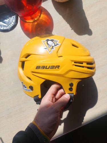 Used Medium Bauer  Re-Akt Helmet Yellow Penguins