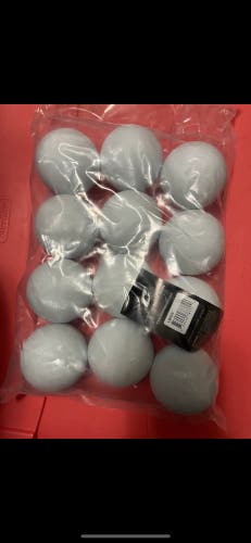 One dozen NOCSAE white new lacrosse balls