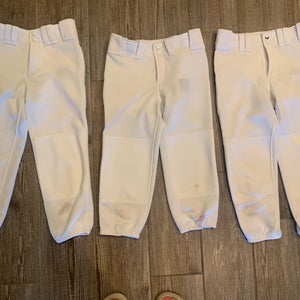 Three pairs of women’s XS low rise Mizuno softball pants.