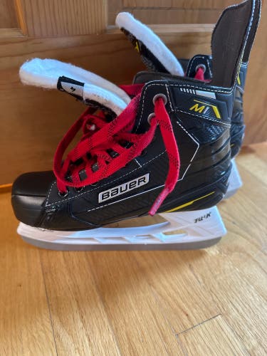 Used Junior Bauer Regular Width Size 4 Supreme M1 Hockey Skates
