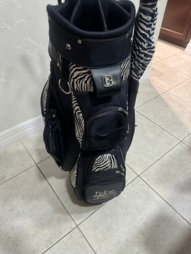 Ladies Golf Cart Bag Zebra Comes with 14 club dividers , rain cover and matching umbrella .