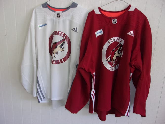 ARIZONA COYOTES red Adidas practice jersey and white practice jersey (both size 58)
