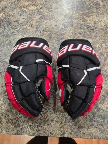Used Bauer Supreme M5 Pro Gloves 14" red/black